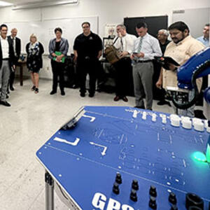photo of faculty and administration in the smart manufacturing lab