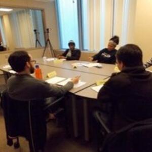 Students attending a lab meeting