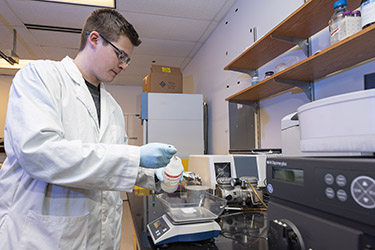 photo of a student in the tissue culture facility