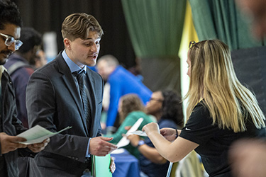 photo of a job seeker and employer at a job fair