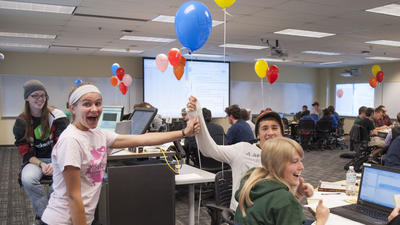 Student receiving a balloon for a correct answer