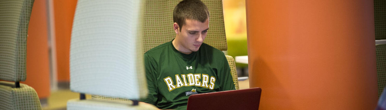 photo of a student using a laptop in russ