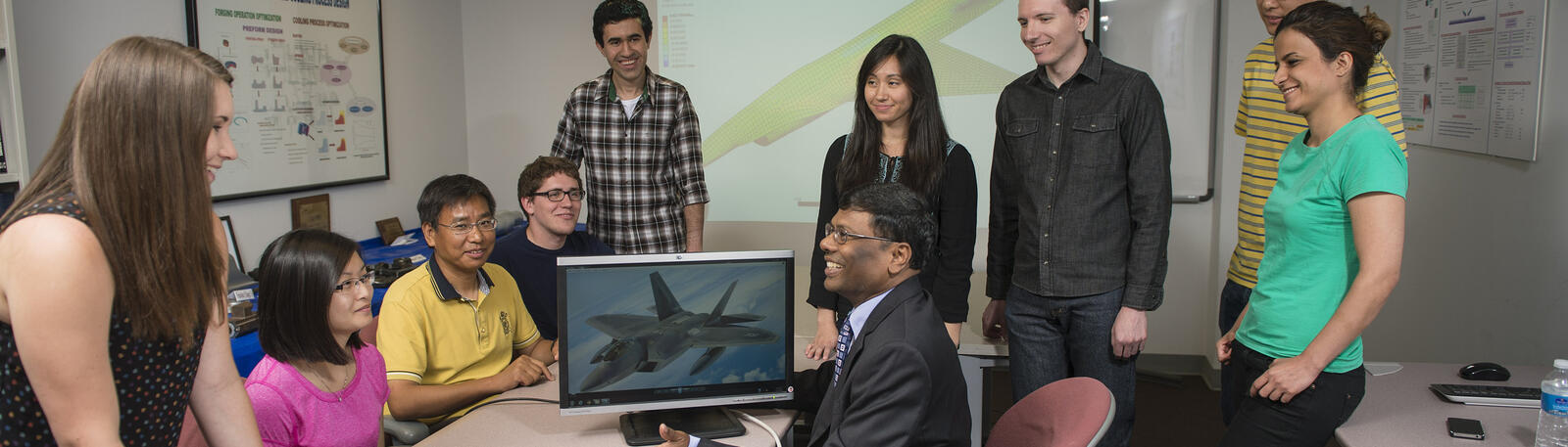 photo of students and a professor in a classroom