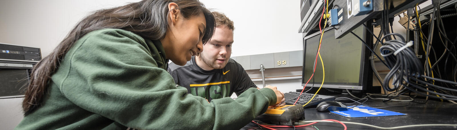 photo of two students working in a lab