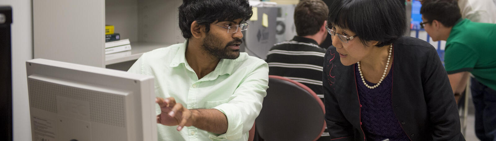 photo of a student and instructor in a lab