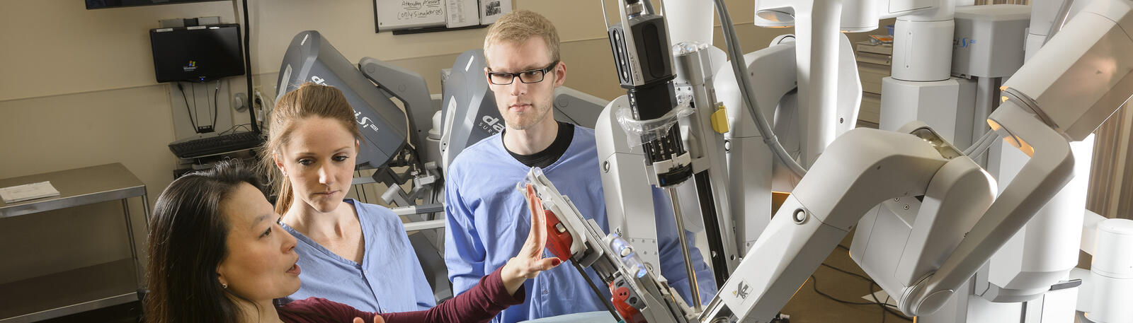 photo of students and a professor in a lab