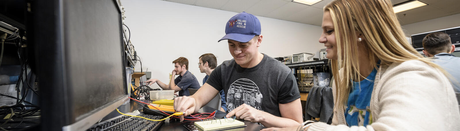 photo of two students working in a lab