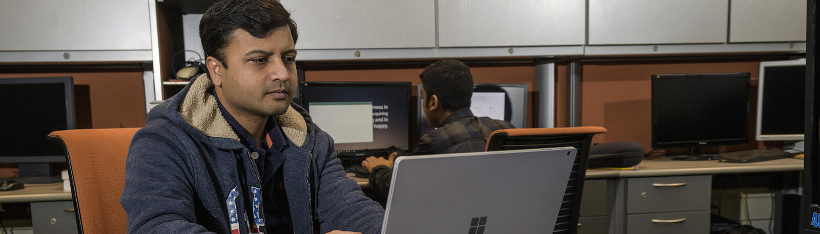 photo of a student using a laptop in russ