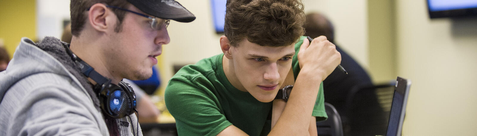 photo of two students working in a classroom